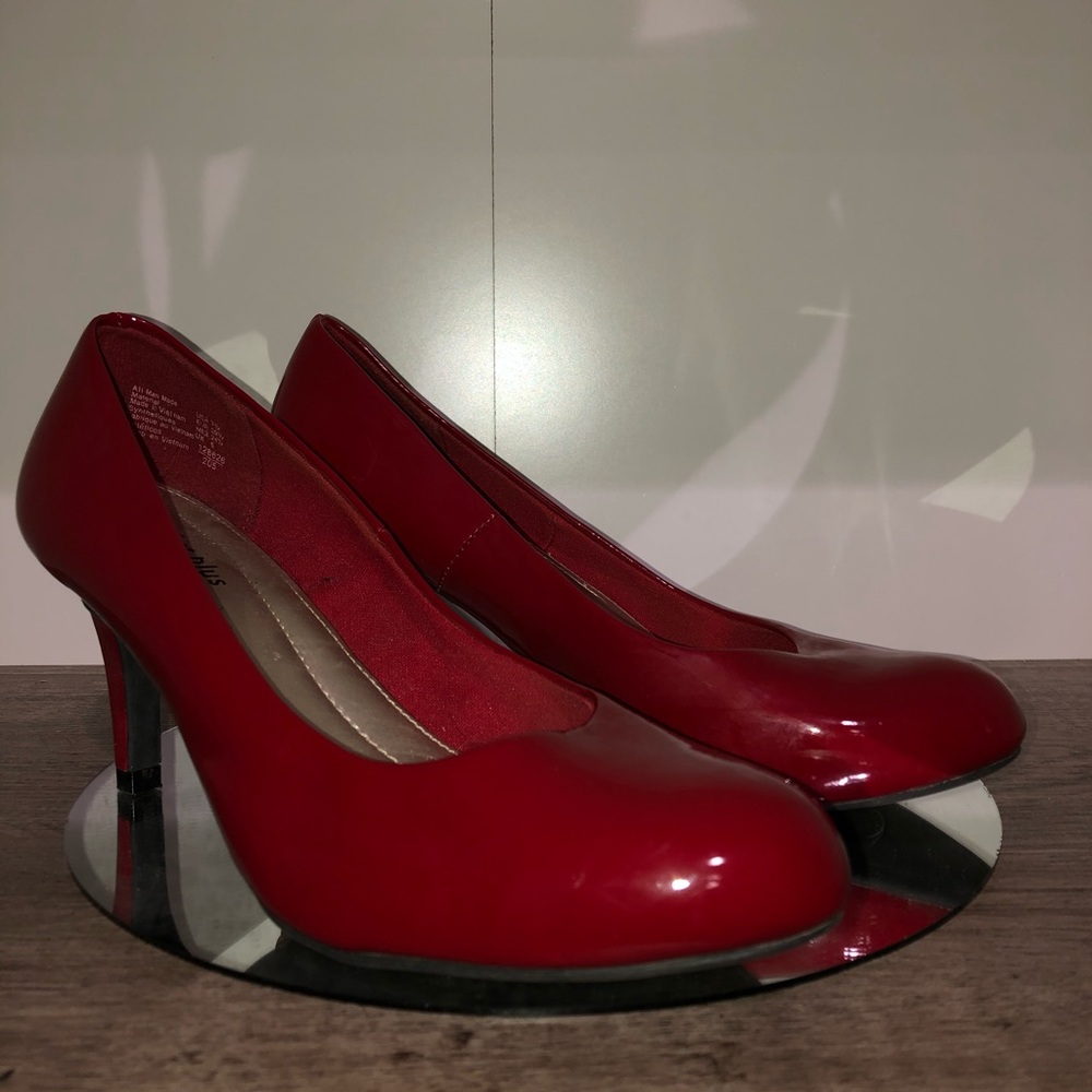 Red patent pumps